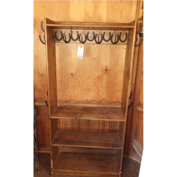 wood storage shelf with handcrafted horseshoe hanging hooks