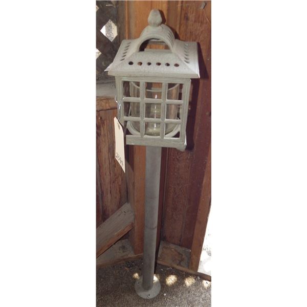 Cast Candle display light approximately three feet tall