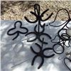 Image 2 : handcrafted iron items featuring horseshoes  etc