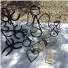 Image 3 : handcrafted iron items featuring horseshoes  etc