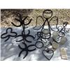 Image 4 : handcrafted iron items featuring horseshoes  etc