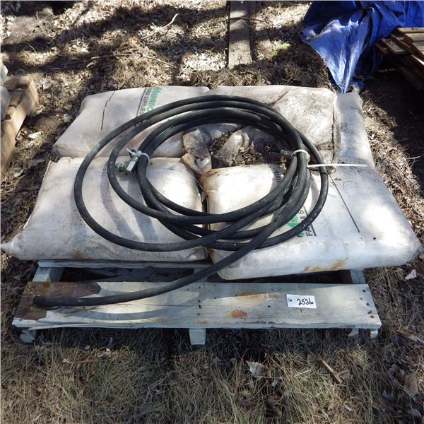 Hydraulic hose and   4 bags of nitrogen fertilizer - has been damp and is rock solid
