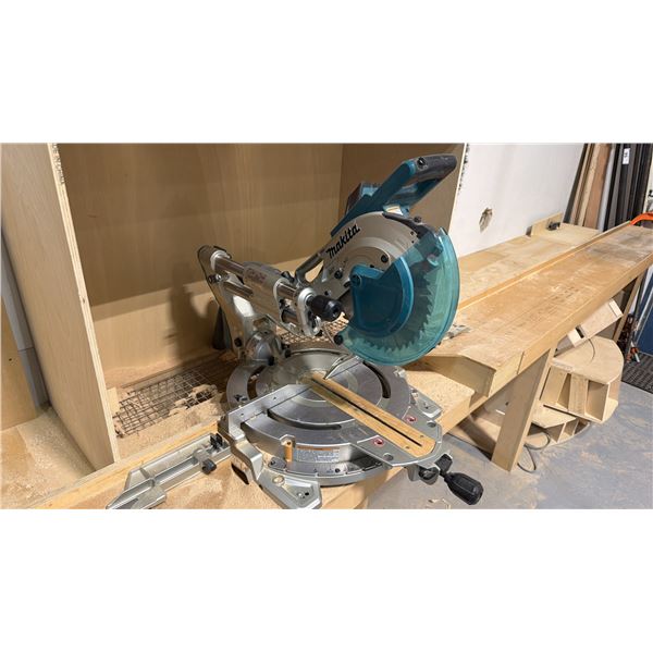 MAKITA MODEL LS1019L 10" SLIDING COMPOUND MITRE SAW WITH APPROX. 15FT WORK BENCH
