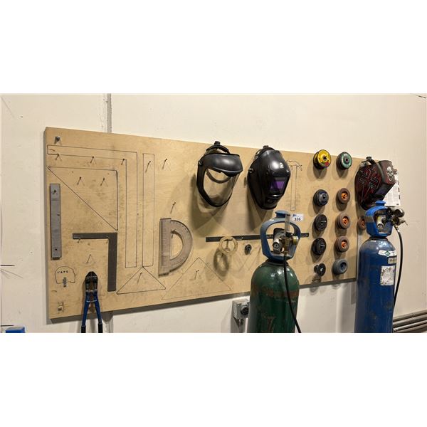 WALL MOUNTED TOOL BOARD WITH ASSORTED WELDERS ITEMS - HELMETS, ABRASIVE DISCS AND HAND TOOLS