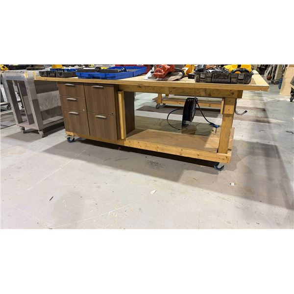 LARGE WOODEN MOBILE WORK TABLE WITH MOUNTED AIR LINE REELER AND 7 DRAWERS OF ASSORTED