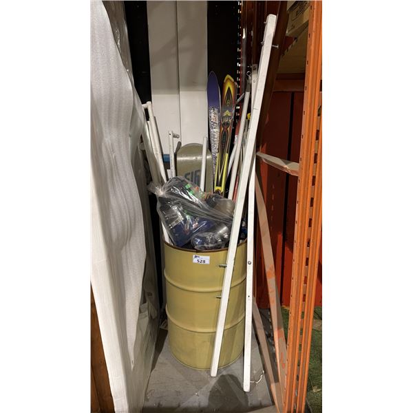 BARREL OF DOWN HILL SKI'S/SNOWBOARD AND WHITE METAL RACK