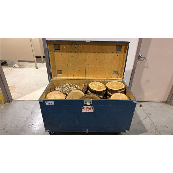 MOBILE TRANSPORT BOX FILLED WITH WOOD PIECES AND STONE MOSAICS