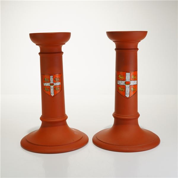 Two Wedgwood Rosso Antico Terracotta Candlesticks with University of Cambridge Coat of Arms