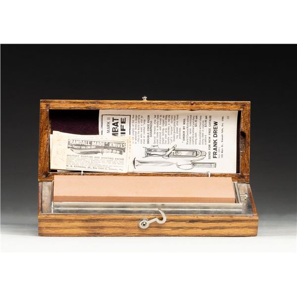 PAIR OF KNIFE SHARPENING STONES IN WOOD CASE.