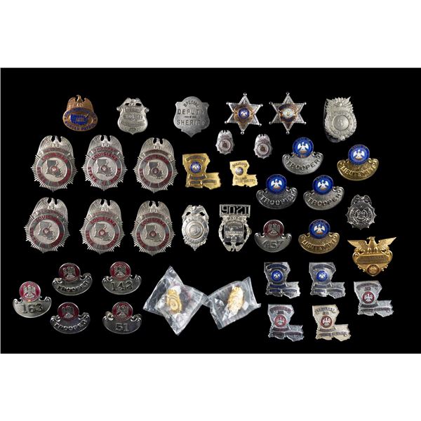 LARGE GROUP OF POLICE BADGES.