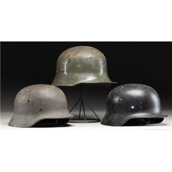 3 WWI & WWII GERMAN HELMETS.