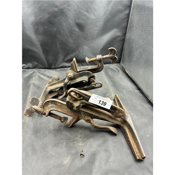 2 antique metal clamps