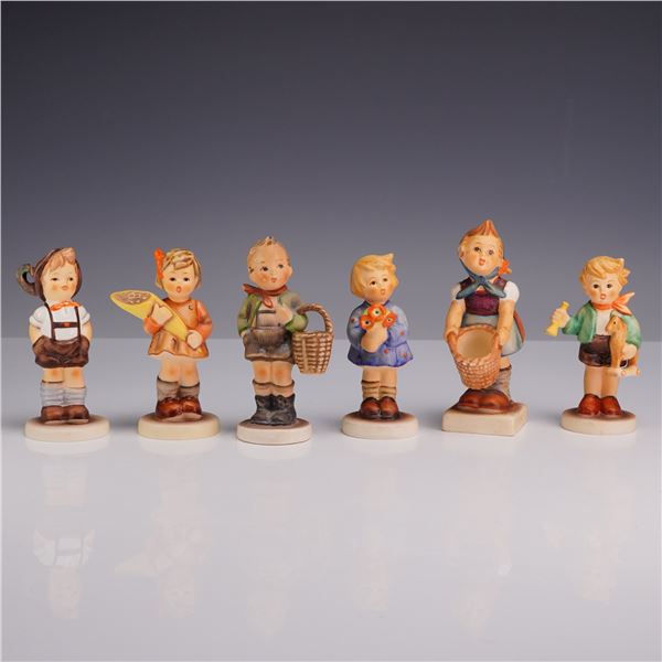 A Grouping of Six Goebel M.I. Hummel Hand-Painted Ceramic Figurines