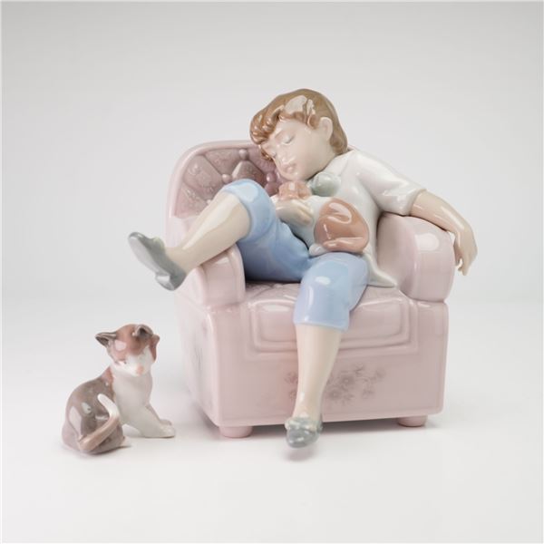 Two Lladro Glazed Porcelain Figurines, Naptime 01006540 and Sitting Cat