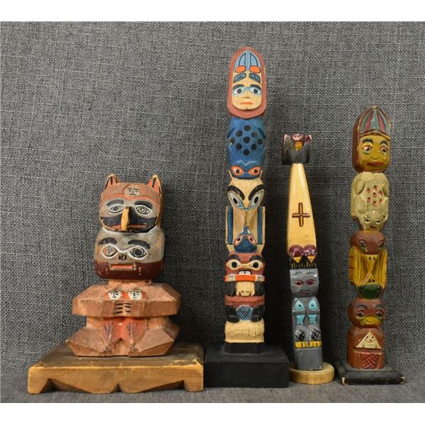 FOUR DECORATIVE TOTEM POLLS