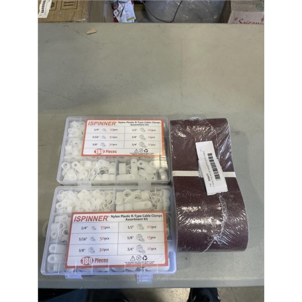 2 NEW PACKS OF ASSORTED SIZE CABLE CLAMPS AND PACK OF 4X36 SANDING BELTS