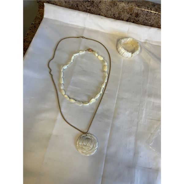 2 MOTHER OF PEARLS NECKLACES AND ONE BRACELET
