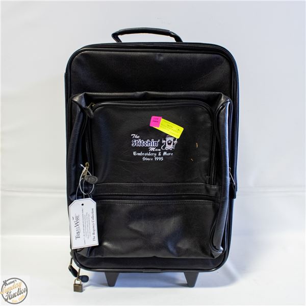 NEW - TRAVEL WARE WHEELED LEATHER SUITCASE