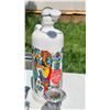 Image 4 : Decorative Mixed Lot Featuring Ceramic Bottle, Ashtray, Lighters, and Figurines