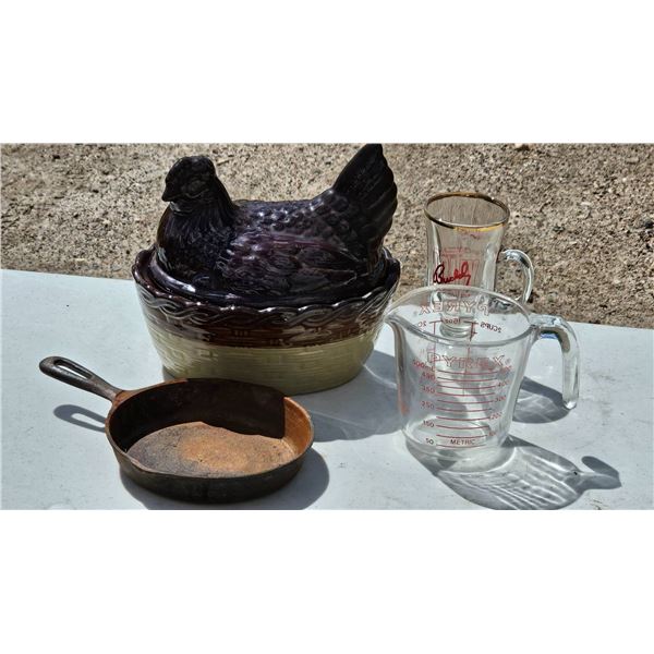 Glass Measuring Cups, Cast-Iron Pan, and Ceramic Hen-Inspired Dish with Lid