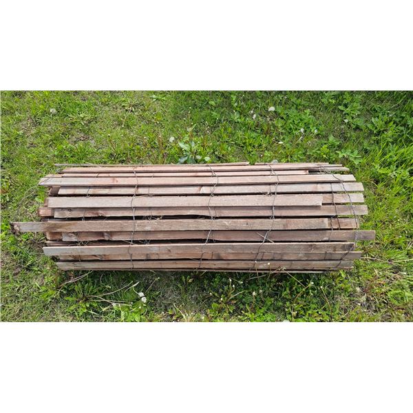Bundle of Weathered Wooden Slats Secured with Wire Ties