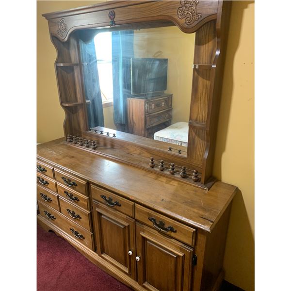 Wooden Dresser with Attached Mirror and Decorative Accents