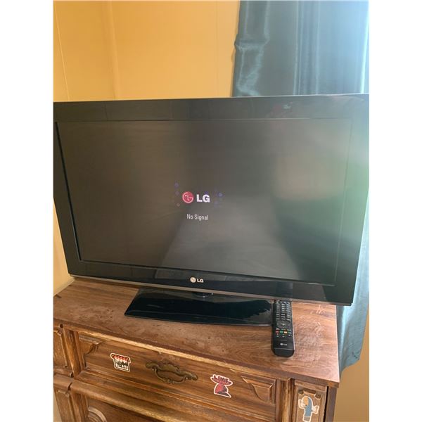 LG Flat Screen TV with Remote - Functional and Ready to Use