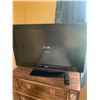Image 1 : LG Flat Screen TV with Remote - Functional and Ready to Use