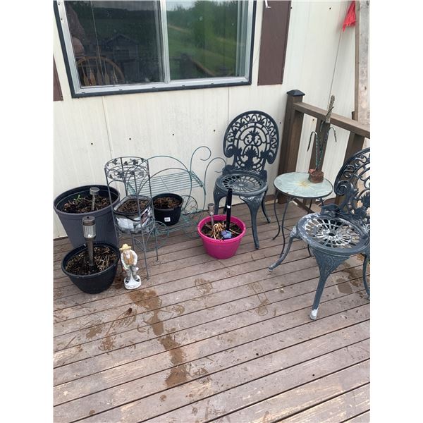 Two Metal Patio Chairs With Side Table and Planters