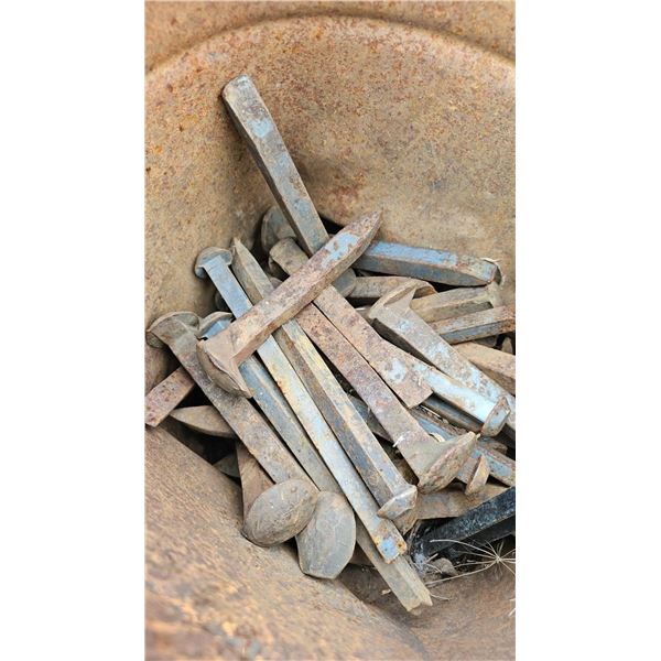 Rusted Metal Spikes and Bucket With Iron Weight