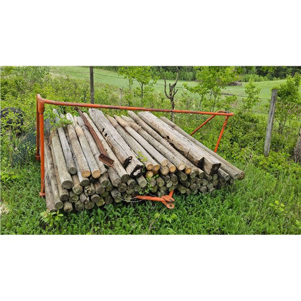 Rustic Wooden Fence Posts With Barbed Wire Roll and Metal Frame