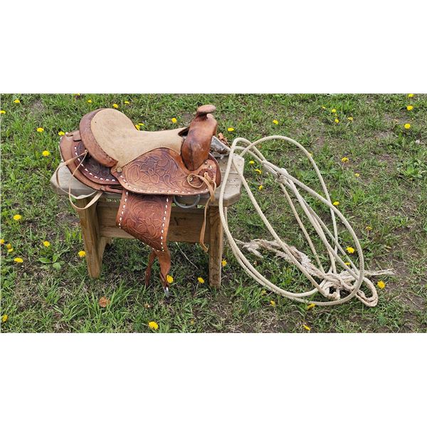 Western Leather Saddle with Hand-Tooled Floral Design and Lasso