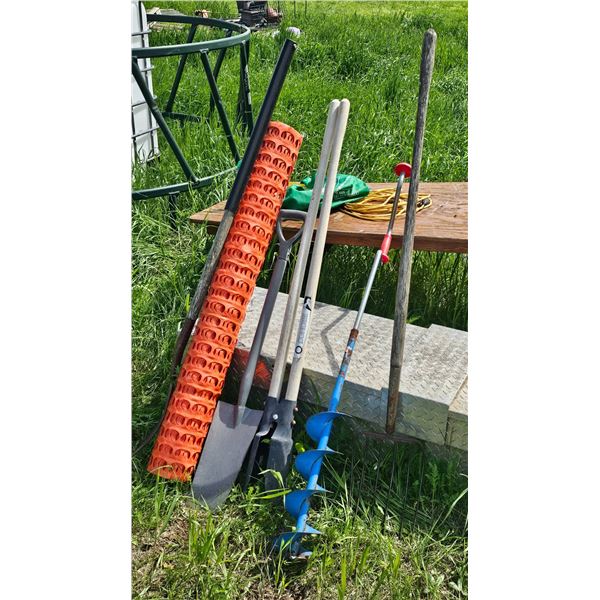 Outdoor Tools Including Auger, Shovels, and Safety Fence