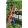 Image 1 : Outdoor Tools Including Auger, Shovels, and Safety Fence