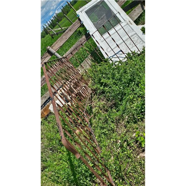 Rustic Metal Gate and Weathered Wooden Screen Door