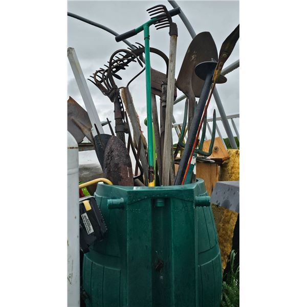 Garden Tools in a Green Plastic Storage Barrel