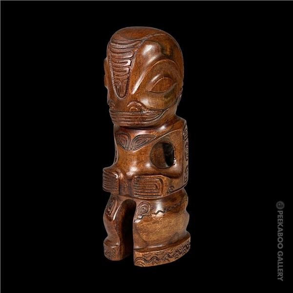 CARVED HARDWOOD MARQUESAN TIKI FIGURE.