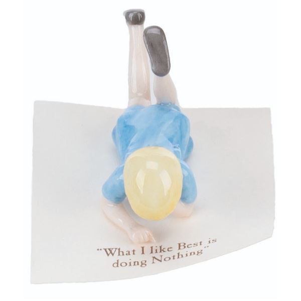 A Mini "Winnie the Pooh" Christopher Robin Figurine.