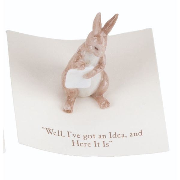 A Mini "Winnie the Pooh" Rabbit Figurine.
