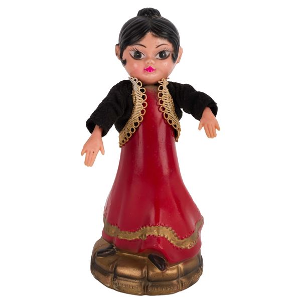 A World’s Fair Small World Spanish Dancer Souvenir.