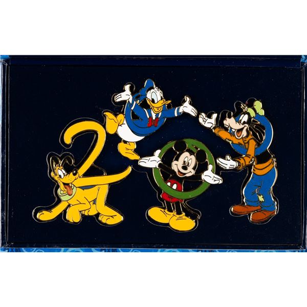 A Walt Disney World "Hand in Hand 2000" Pin Set.