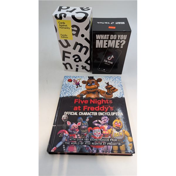 Family Edition Cards Against Humanity, What Do You Meme? Game, & Five Nights at Freddy's Encyclopedi