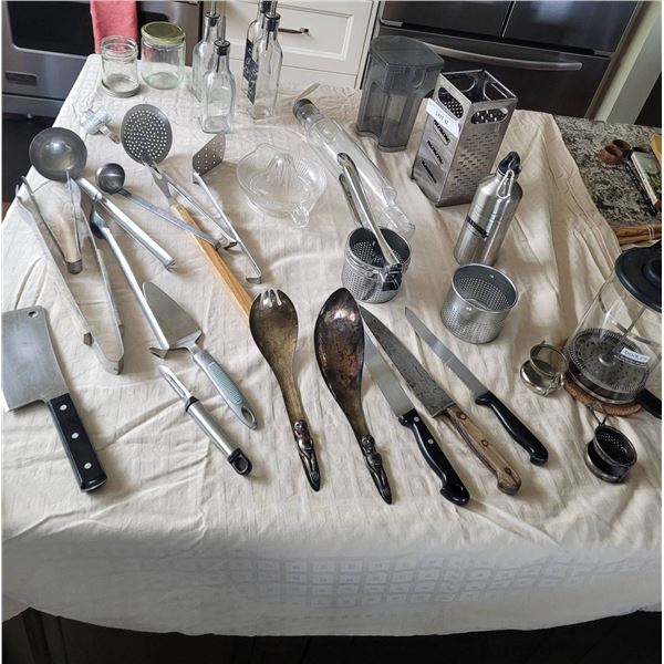Kitchen Utensils and Decor Including Tools, Glass Bottles, and Strainers