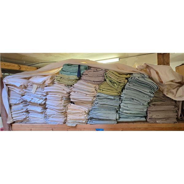 Shelf of Assorted Folded Fabrics and Textiles