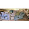Image 1 : Shelf of Assorted Folded Fabrics and Textiles