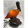 Image 1 : VINTAGE PELICAN COLORED GLASS AND METAL LAMP