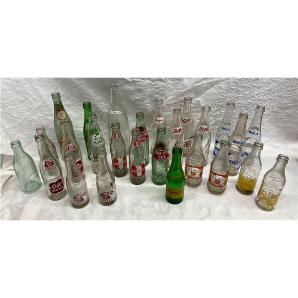 COLLECTION OF VINTAGE SODA POP BOTTLES INCLUDES SEVERAL BRANDS FROM THE MID-20TH CENTURY