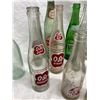Image 4 : COLLECTION OF VINTAGE SODA POP BOTTLES INCLUDES SEVERAL BRANDS FROM THE MID-20TH CENTURY