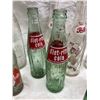 Image 7 : COLLECTION OF VINTAGE SODA POP BOTTLES INCLUDES SEVERAL BRANDS FROM THE MID-20TH CENTURY