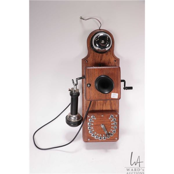 Vintage wood-cased Strowger Automatic electric telephone circa 1910 features numbers up to 16